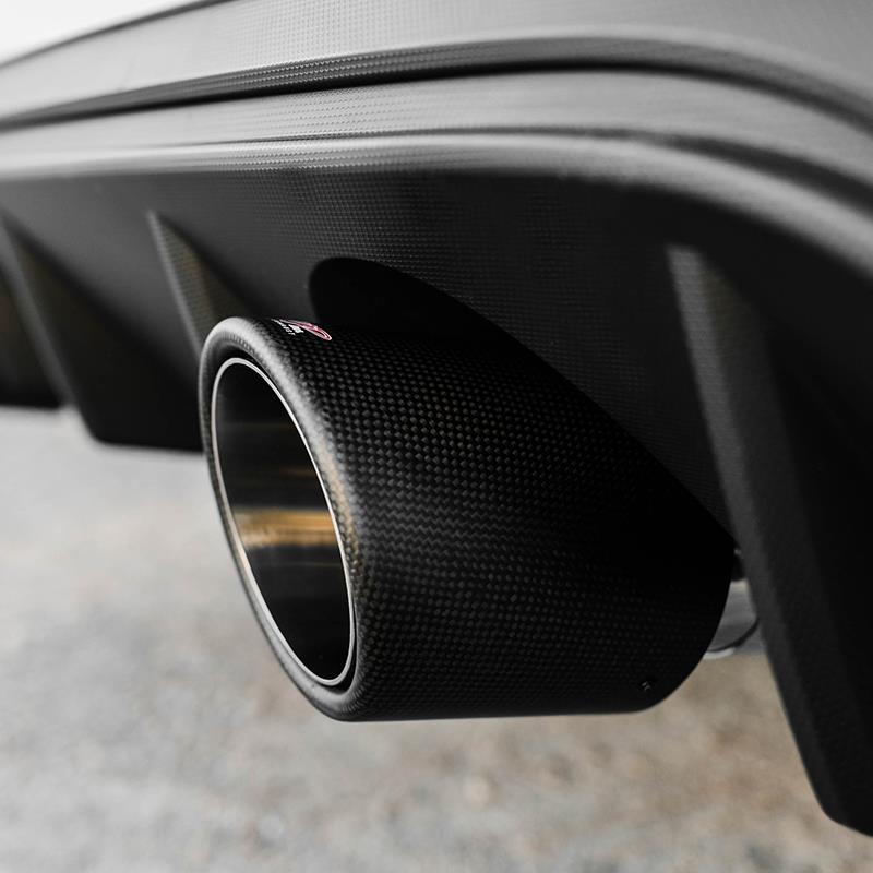MBRP dual-wall exhaust tip with a carbon fiber outer shell and a polished stainless steel 4-inch outlet.
