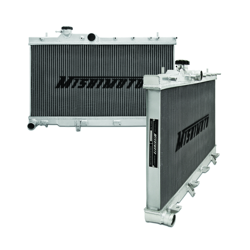 Mishimoto dual-core aluminum radiator with polished TIG-welded end tanks and 1.3 bar high-pressure radiator cap.