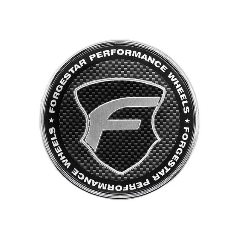 Forgestar 2.45-inch flat wheel center cap featuring a carbon fiber lens and a polished chrome base.