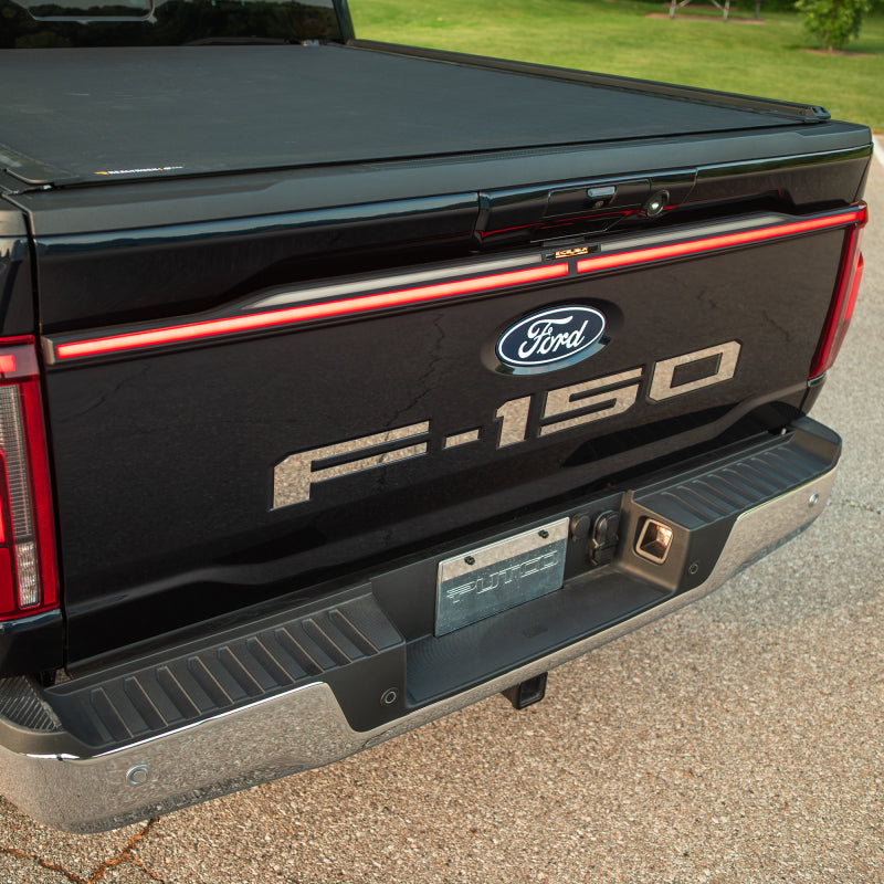 Putco Excalibur LED Tailgate Light Bar showing the red jeweled lens and sequential turn signal on a Ford F-150 Lightning.