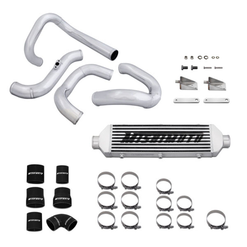 Silver Mishimoto Z Line intercooler with mandrel-bent aluminum charge piping, silicone couplers, and T-bolt clamps.