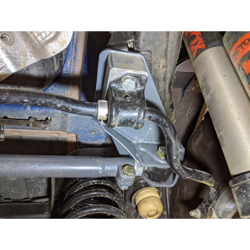 Black powder-coated Synergy Manufacturing steel rear track bar reinforcement brace for Jeep Wrangler JL.