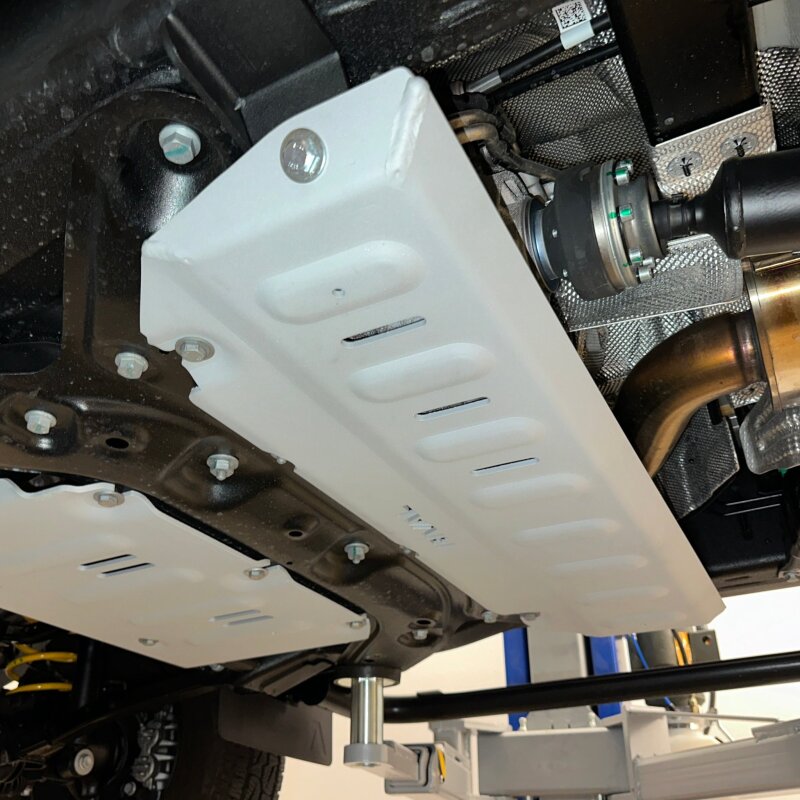 Rival deep-stamped 1/4-inch aluminum transfer case skid plate for INEOS Grenadier and Quartermaster models.