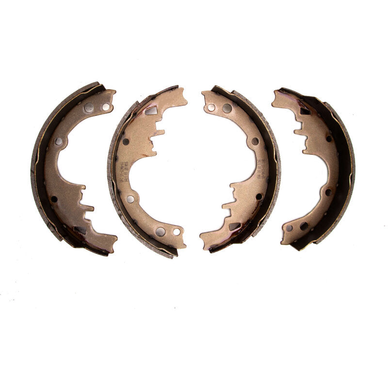 DFC semi-metallic brake shoes with black anti-rust coating and precision-ground friction material.