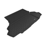 Black 3D MAXpider Kagu Series cargo liner with carbon fiber texture and raised edges for a 2015-2023 Ford Mustang.