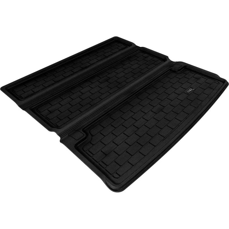 Black 3D MAXpider Kagu Series cargo liner with custom-fit raised edges and textured carbon fiber style surface.