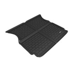 Black 3D MAXpider Kagu cargo liner with carbon fiber texture and raised edges for a Tesla Model X.