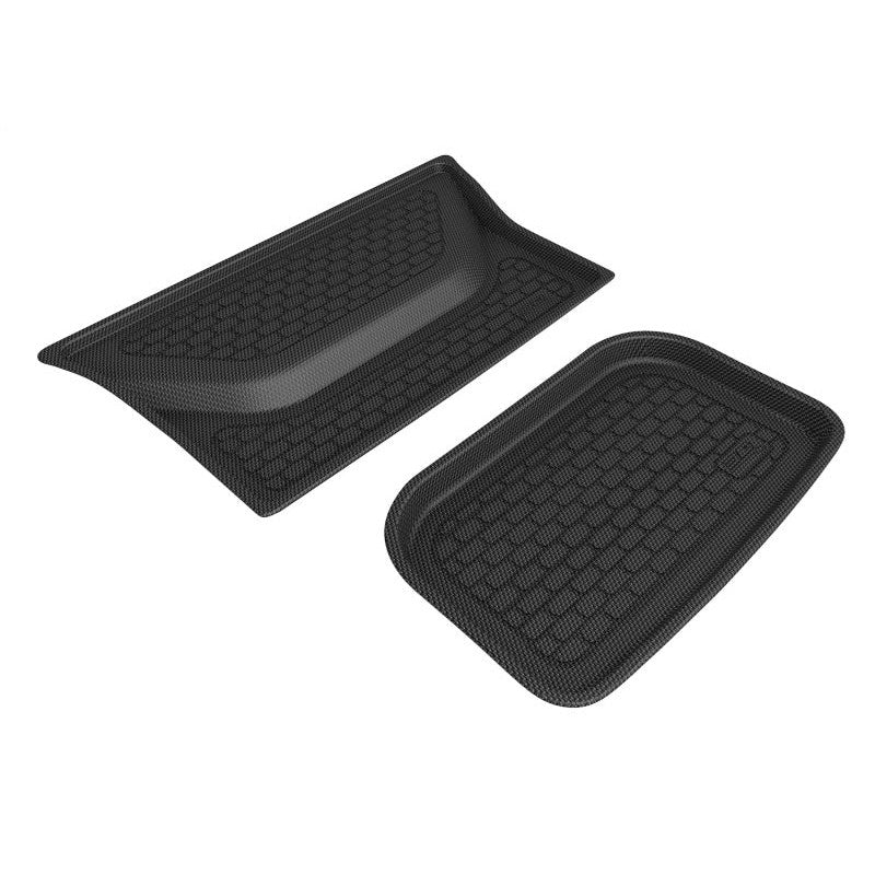 Black 3D MAXpider Kagu Series lower cargo liner with carbon fiber texture and raised edges for Tesla Model X and Model Y.