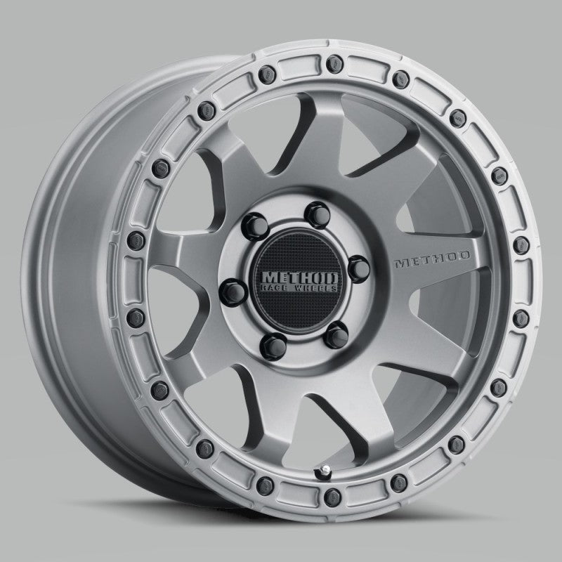 Method MR317 Matte Titanium 18x9 wheel featuring a nine-spoke design and simulated beadlock undercut lip.