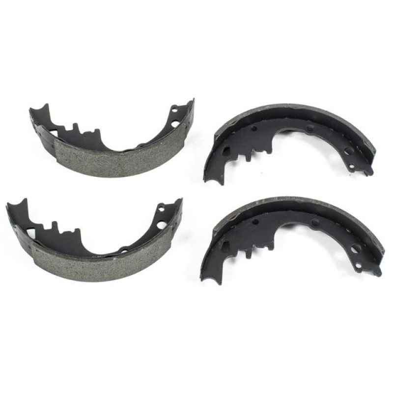 A pair of Power Stop Autospecialty semi-metallic brake shoes on black coated steel backing plates.