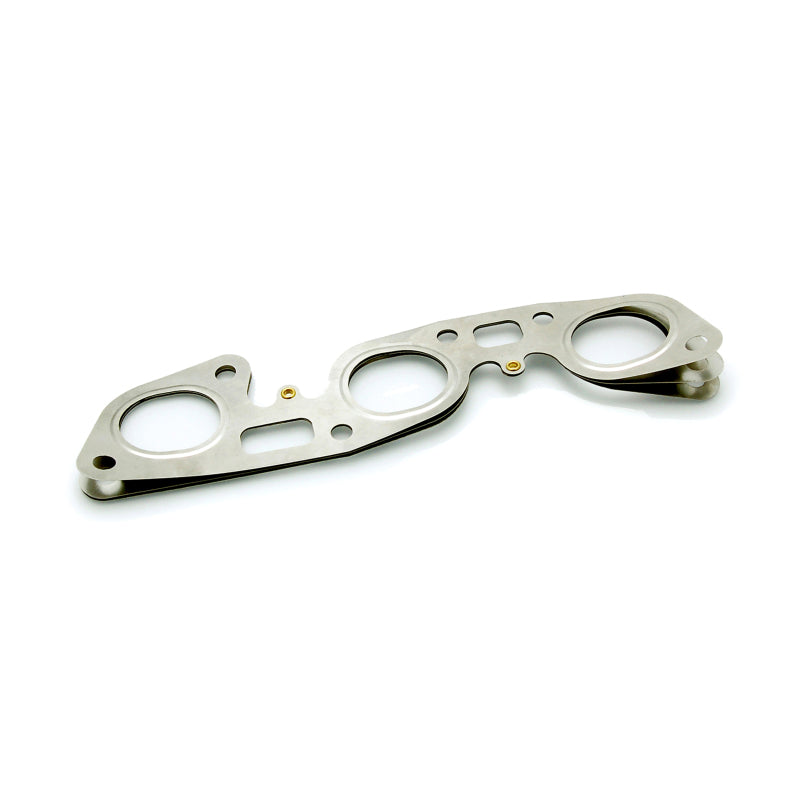 Cometic multi-layer steel (MLS) exhaust manifold gasket for Nissan RB26 engines with precision cut port openings.