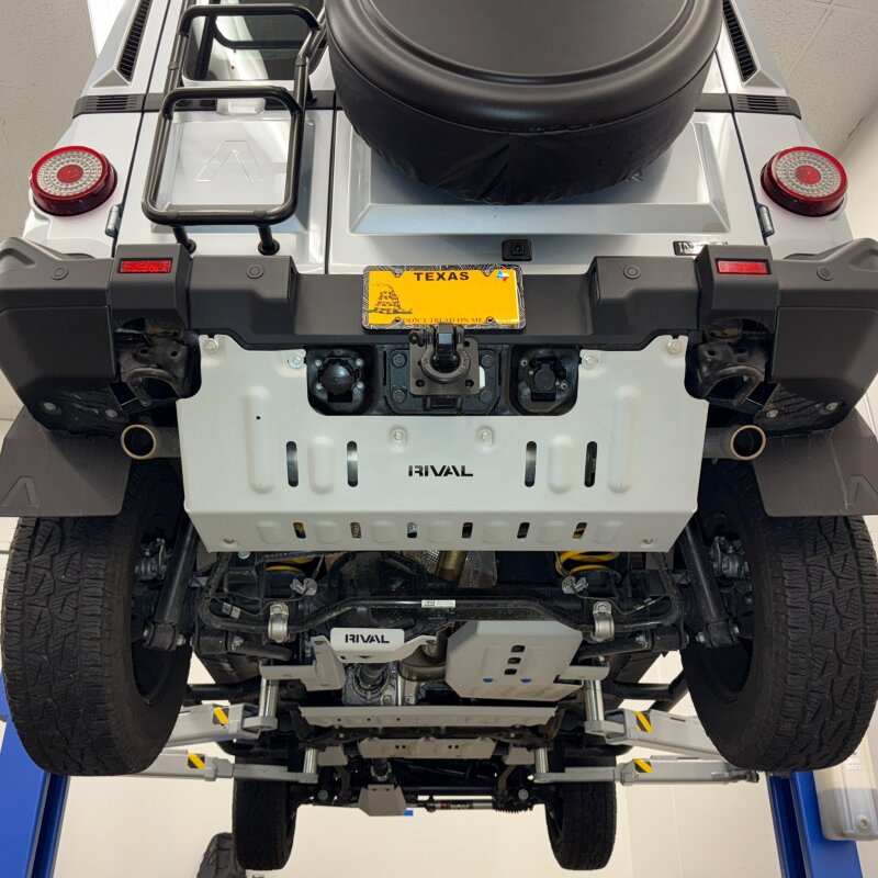 Deep-stamped 1/4-inch aluminum exhaust skid plate with reinforcement ribs for Ineos Grenadier.