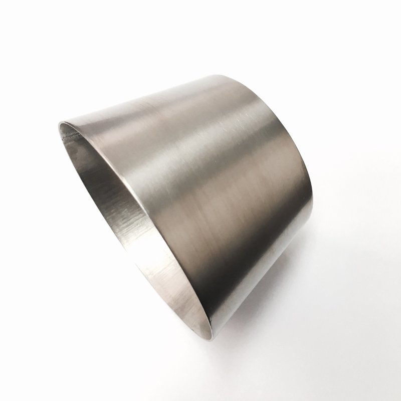 Ticon Industries raw titanium transition reducer cone showing the 3.0 inch to 4.0 inch diameter expansion