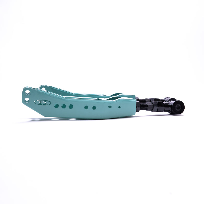A pair of teal powder-coated BLOX Racing rear lower control arms for Subaru WRX, STI, BRZ, and Toyota 86.