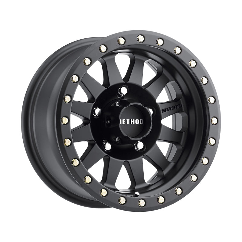 Matte black Method MR304 Double Standard 12-spoke wheel featuring a simulated beadlock lip and push-through center cap.