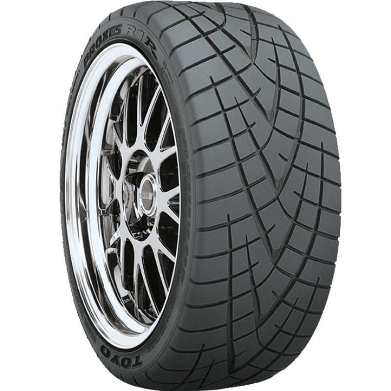 Toyo Proxes R1R extreme performance summer tire showing its aggressive arrowhead tread pattern in size 245/40ZR18.