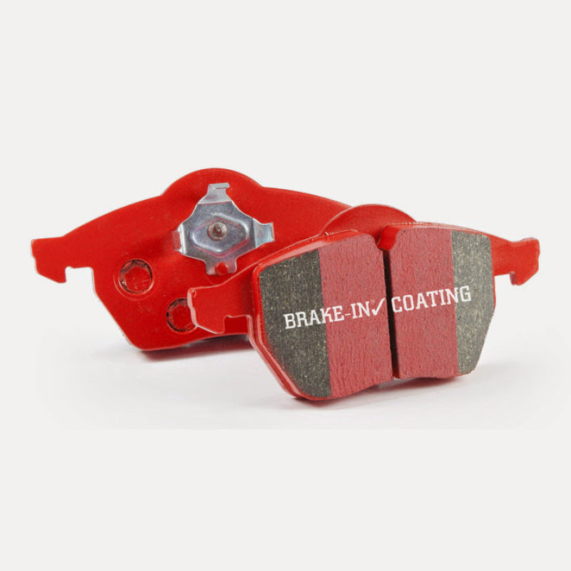 EBC Redstuff performance ceramic brake pads featuring red friction material and backing plates.