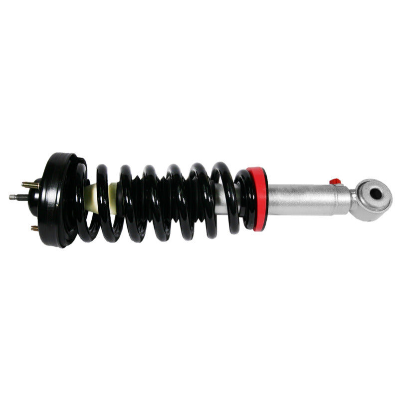 Rancho quickLIFT Loaded leveling strut assembly with coil spring and RS9000XL 9-position adjustment knob.