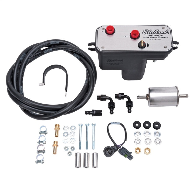 Edelbrock 36031 Universal Fuel Sump Module with included wiring harness, hose, filter, and installation hardware.