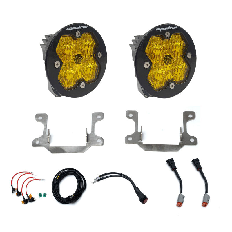 Baja Designs Squadron Sport 2.0 amber LED fog lights with 2019-2025 Ram 2500/3500 specific mounting brackets.