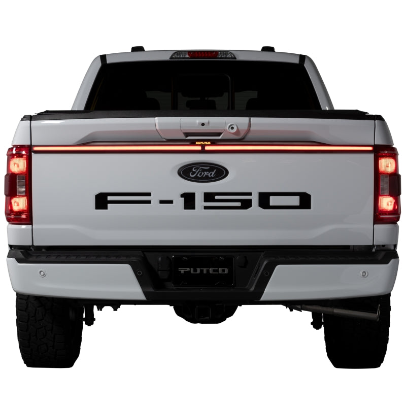 Putco Excalibur LED tailgate light bar with red jeweled housing and sealed polycarbonate enclosure.