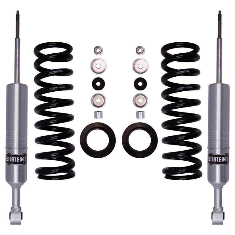 Bilstein B8 6112 front suspension kit featuring two 60mm shock absorbers, silver coil springs, and billet spring seats.