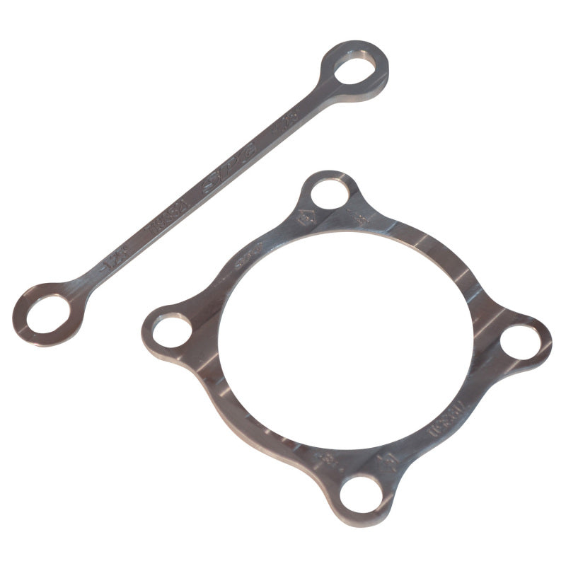 SPC Performance 71935 aluminum full-contact camber shim and caliper spacer.