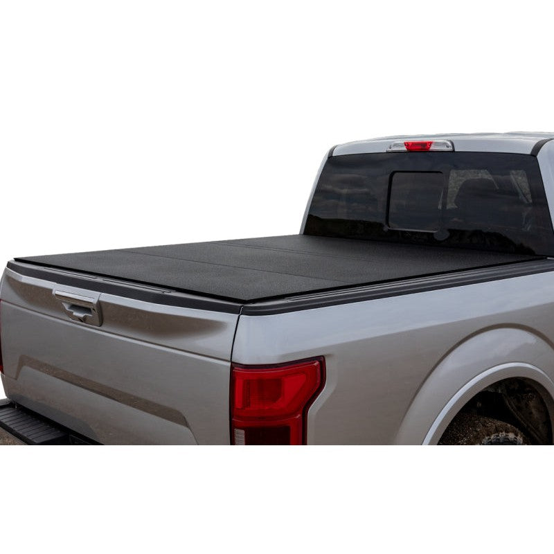 LOMAX Hard Tri-Fold Tonneau Cover in Black Urethane finish installed on a 2024-2025 Ford Ranger 5ft bed.