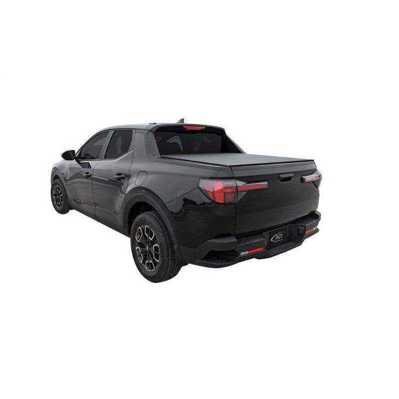 LOMAX Stance textured matte black hard tri-fold tonneau cover installed on a Hyundai Santa Cruz