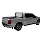 Low-profile black LOMAX Stance hard tri-fold tonneau cover installed on a pickup truck bed