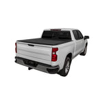 Low profile Access LOMAX hard tri-fold tonneau cover in black urethane installed on a Toyota Tacoma with a 6-foot bed.