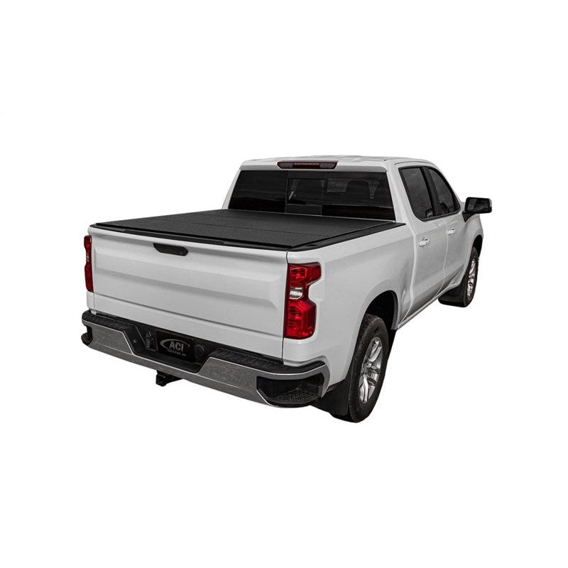 Access LOMAX low-profile black urethane hard tri-fold tonneau cover on a GMC Sierra 2500 HD with 6' 8" bed.