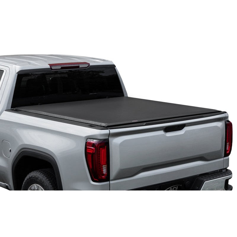 Access Lorado low-profile black roll-up tonneau cover installed on a pickup truck bed