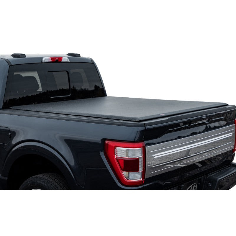 Access Lorado low-profile roll-up tonneau cover installed on a 6ft Nissan Frontier truck bed.