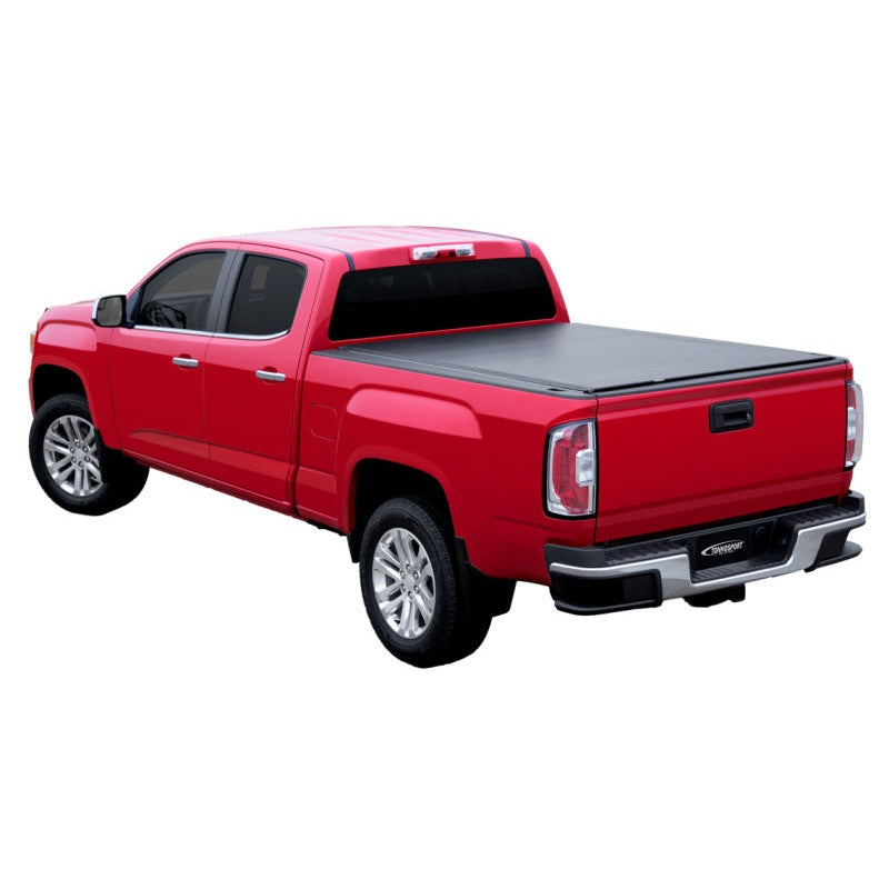 Access TonnoSport low-profile black roll-up tonneau cover installed on a truck with a 6ft stepside bed.