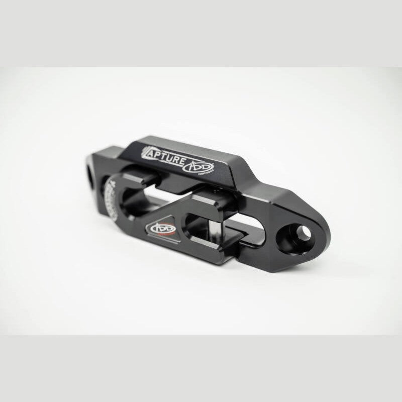 Black hard-anodized 1-5/16 inch aluminum winch fairlead with recessed pocket for a round end hook.