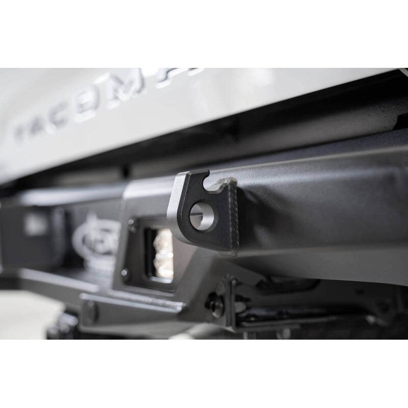 Addictive Desert Designs Hammer Black Stealth Fighter rear bumper with sensor cutouts for 2016-2023 Toyota Tacoma