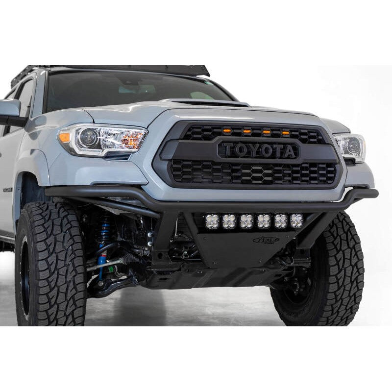 Addictive Desert Designs PRO Bolt-On Front Bumper in Hammer Black with aluminum skid plate for Toyota Tacoma.