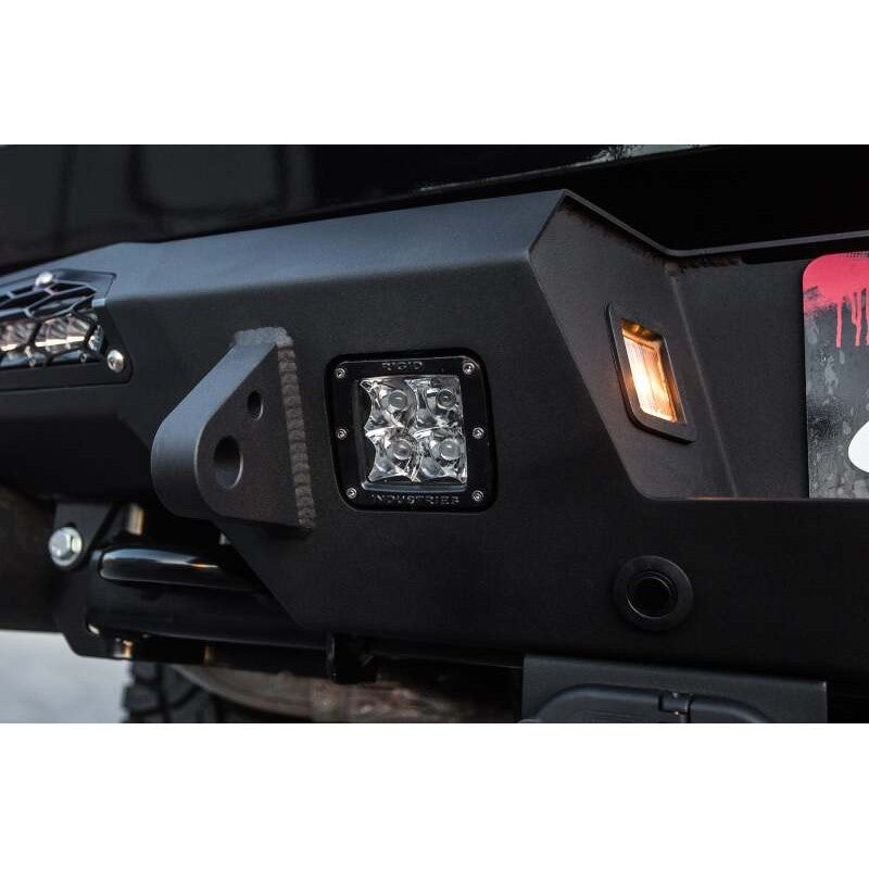 Addictive Desert Designs HoneyBadger steel rear bumper with 10 inch LED mounts and step plates for Ford F-150 Raptor.