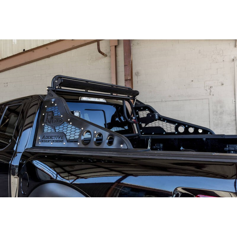 Hammer black Addictive Desert Designs Race Series R chase rack with honeycomb panels and 50-inch light bar mount