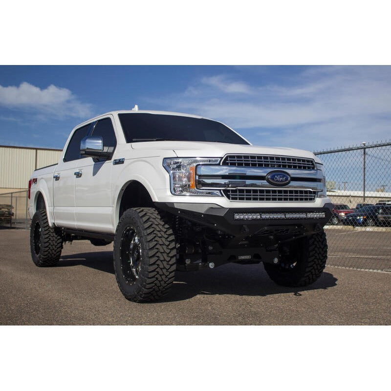 Hammer black Addictive Desert Designs Stealth Fighter front bumper for 2018-2020 Ford F-150 trucks.