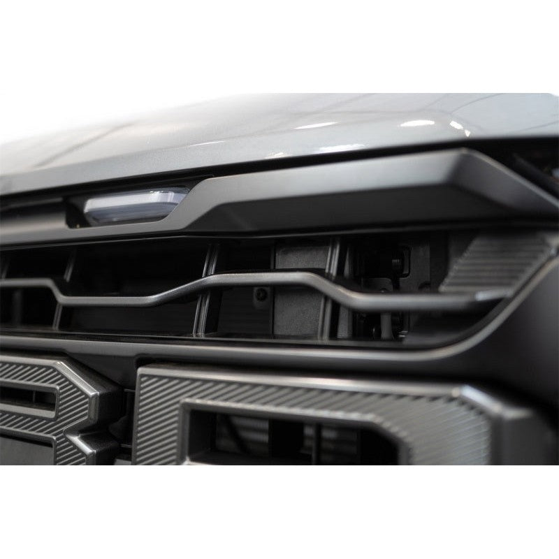 Addictive Desert Designs hammer black Adaptive Cruise Control relocation bracket for 2024-2026 Ford F-150 Raptor.