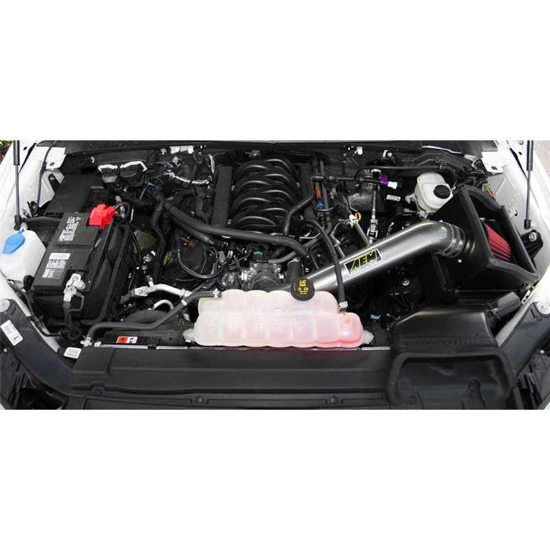 AEM Brute Force air intake system with gunmetal gray aluminum tube and a grey tapered synthetic air filter.