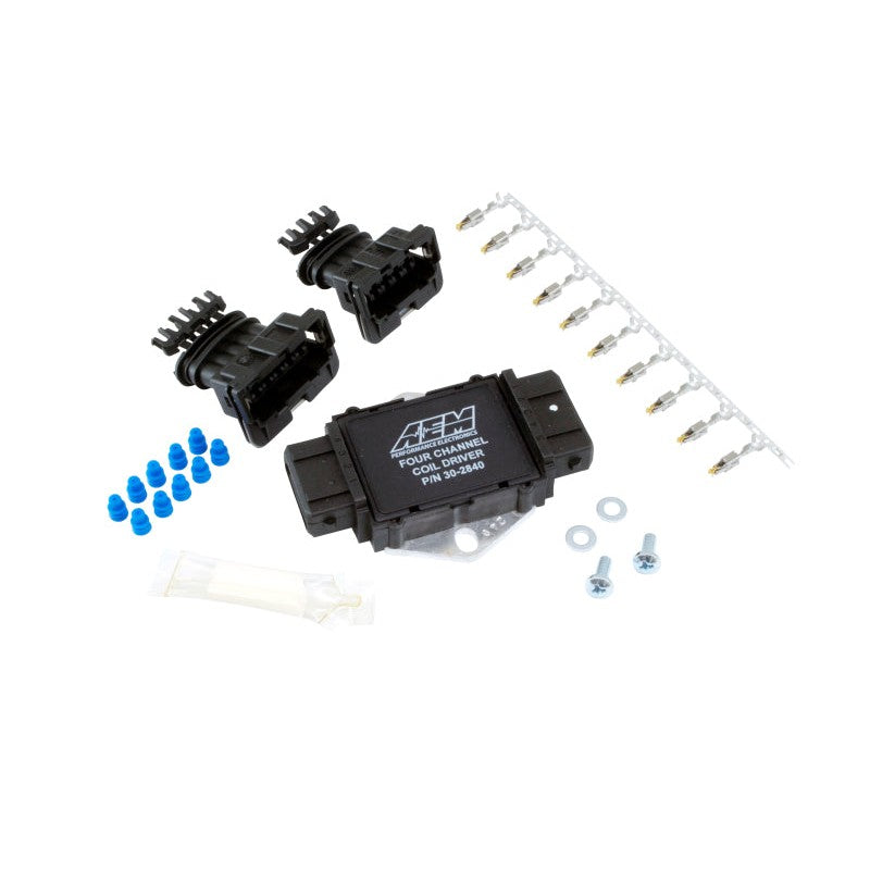 AEM 30-2840 4-channel ignition coil driver module with included wiring harness and mounting hardware.