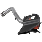 AEM gunmetal gray mandrel-bent aluminum intake tube with a red Dryflow synthetic air filter and black heat shield.