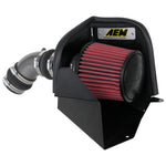 AEM 21-858C cold air intake with gunmetal gray mandrel-bent aluminum tube, heat shield, and red synthetic Dryflow filter.