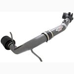 AEM gunmetal gray mandrel-bent aluminum cold air intake system with red Dryflow air filter for 2006-2009 Mazda MX-5 Miata.