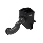 Carbon fiber air intake tube with large blue Pro 5R air filter and black XLPE housing for GM 5.3L and 6.2L engines.