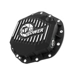 Black powder coated aFe Pro Series rear differential cover with machined fins and oil level sight glass for AAM axles.