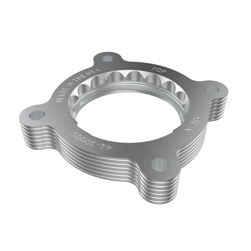Orange anodized CNC-machined aluminum aFe Silver Bullet throttle body spacer for 2021-2026 Subaru Crosstrek.